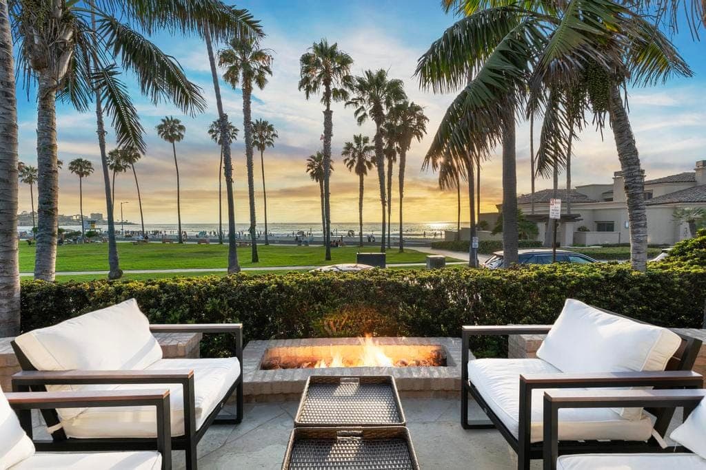 La Jolla Shores beachfront home viewed from the oceanfront patio at sunset