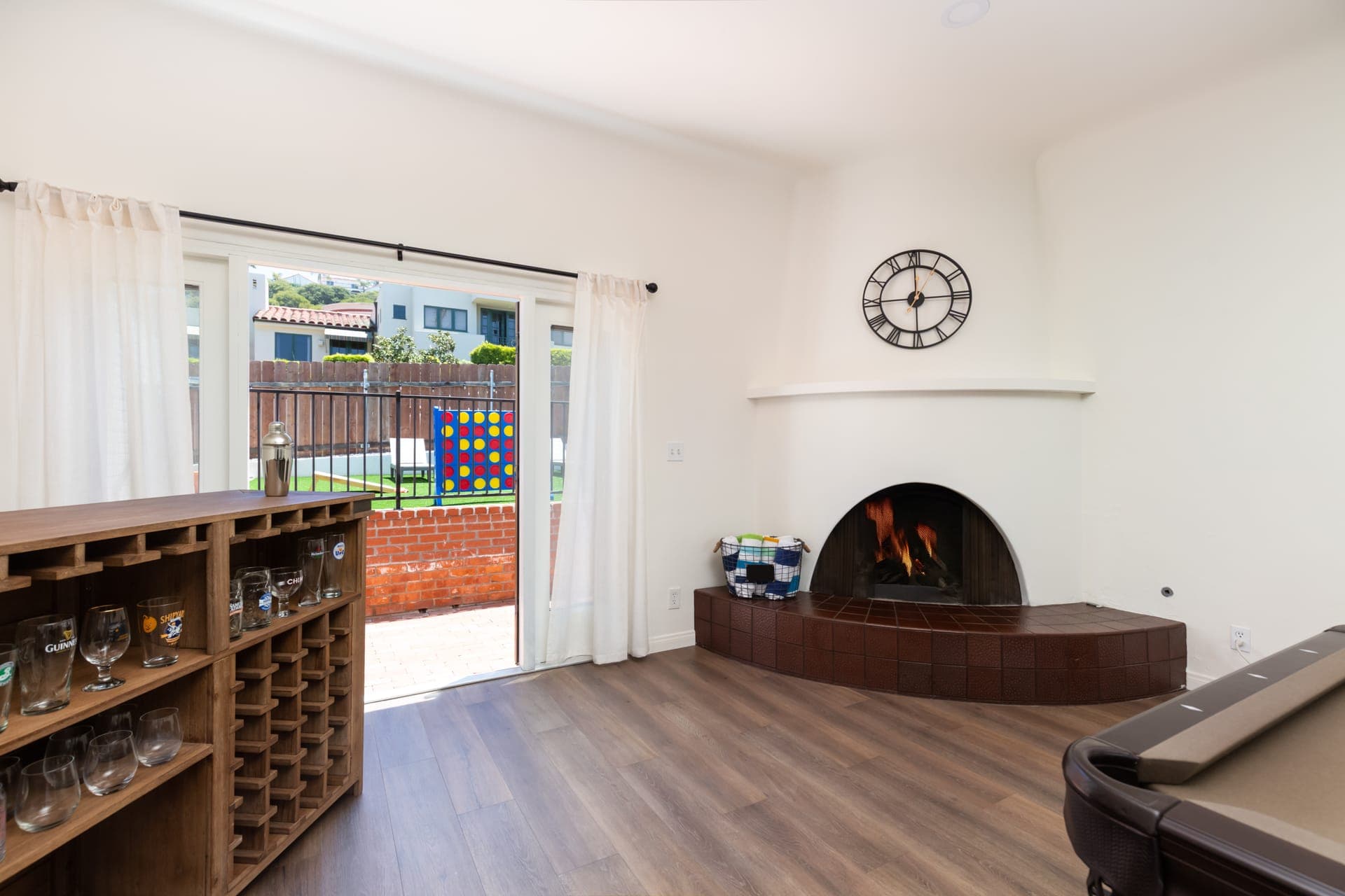 Living room with fireplace and bar area